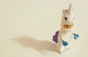 Lego man in a unicorn costume